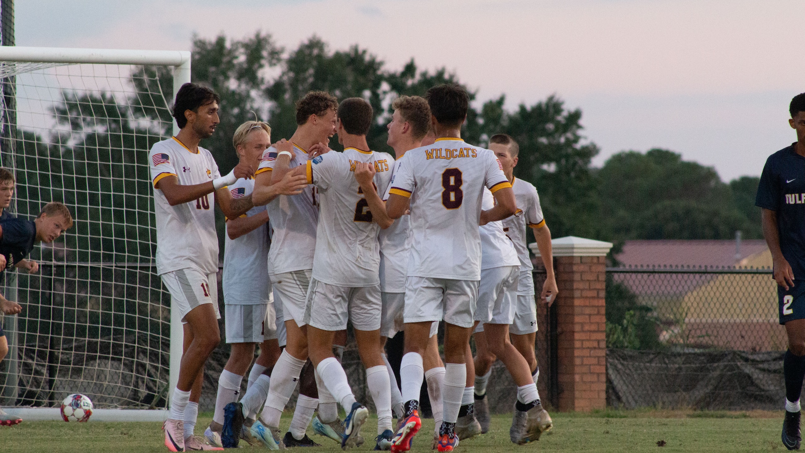 Emil Corfitzen (Copenhagen, Denmark) celebrates with teammates following a goal (Karisa Watkins).